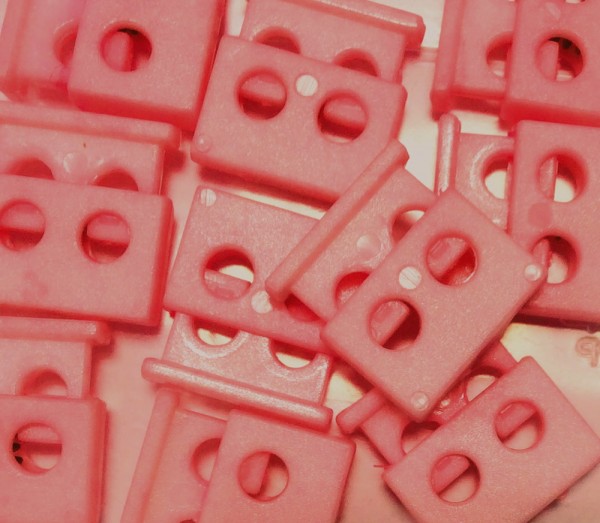 Kordelstopper rosa 2-Loch